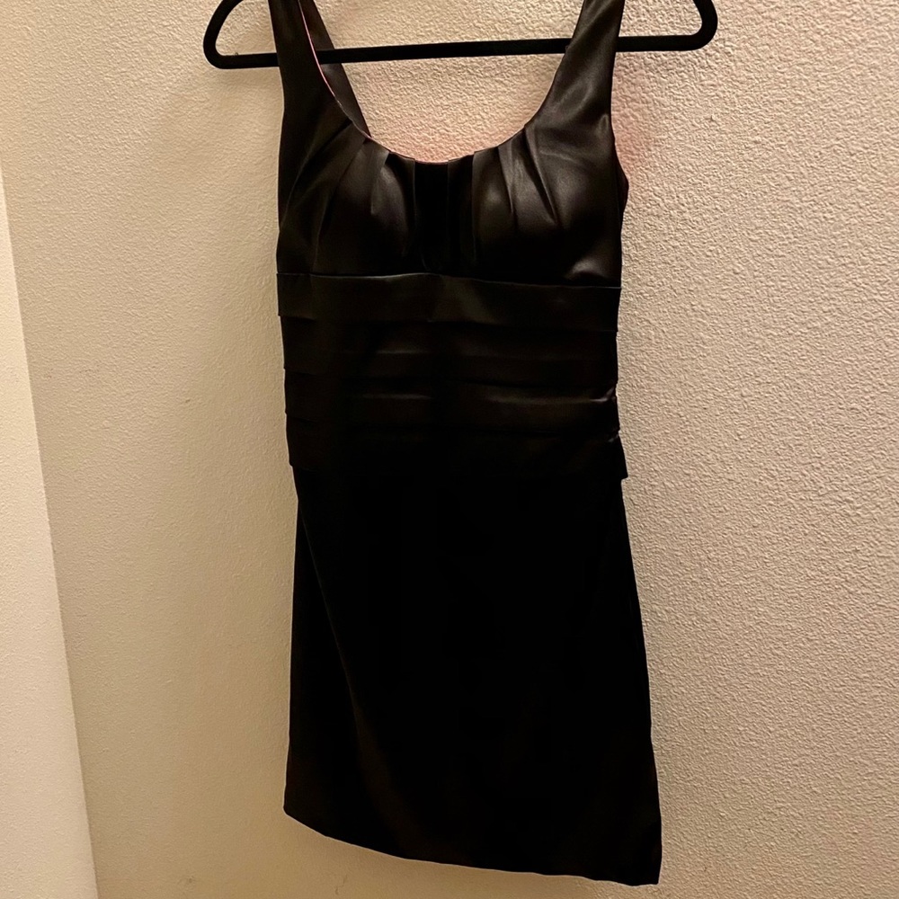 Black LBD with hot pink lining.